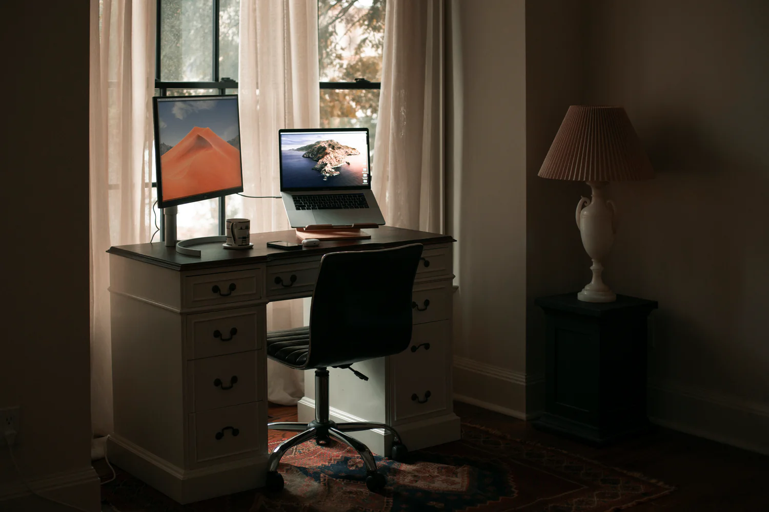 home-office-by-a-window-with-white-curtains